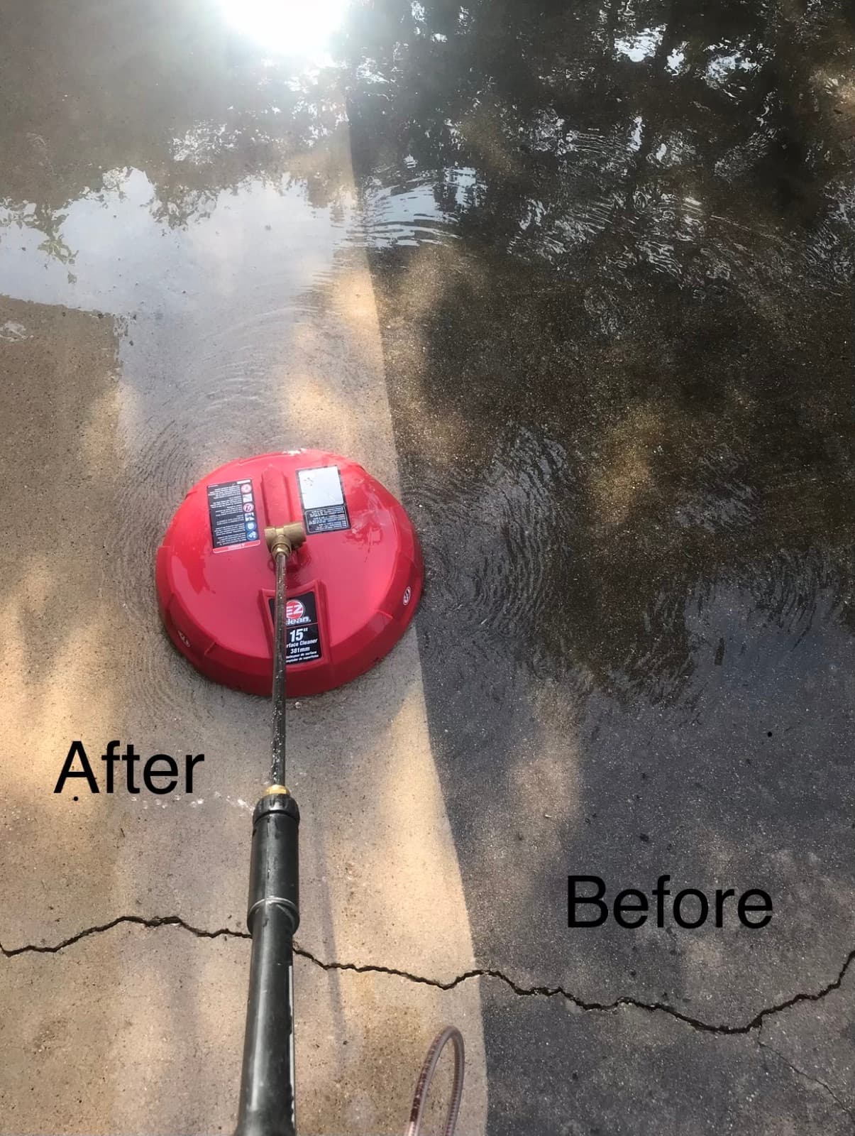 Driveway being cleaned with a surface cleaner