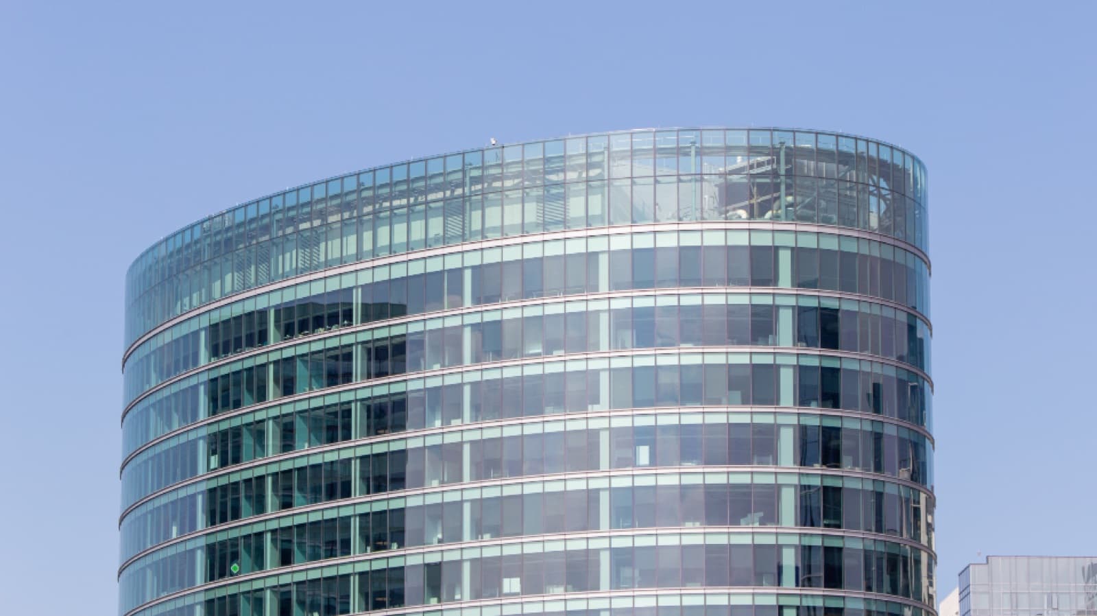 Glass-clad commercial office building with clean windows